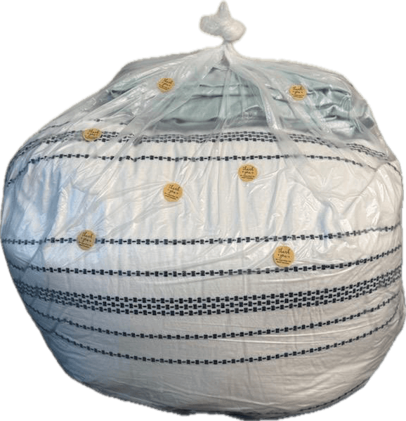 Freshly washed comforter bagged for delivery